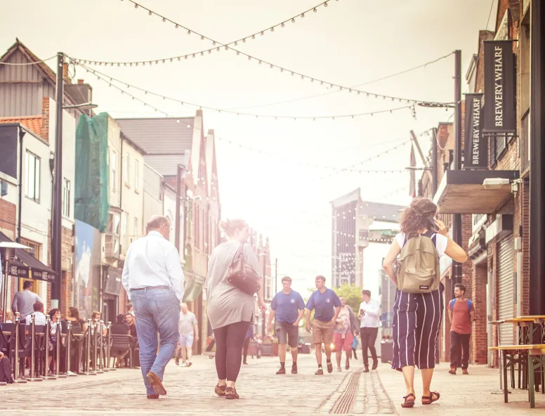 People walking down Humber Street Hull