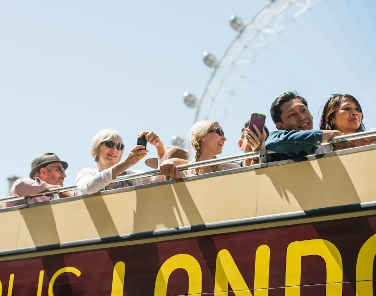Open top bus tour with tourists