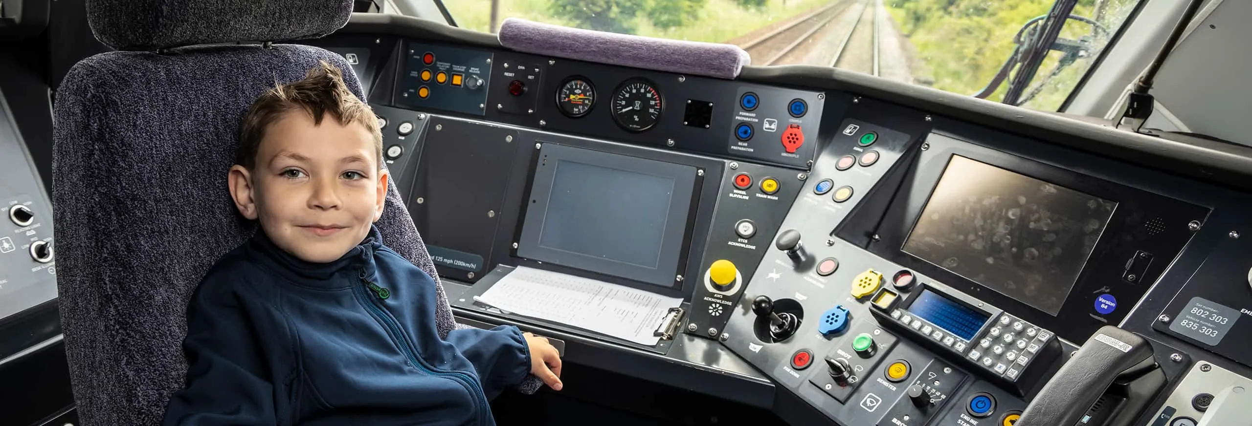 Tyler sat in the drivers cab onboard a Hull Trains service