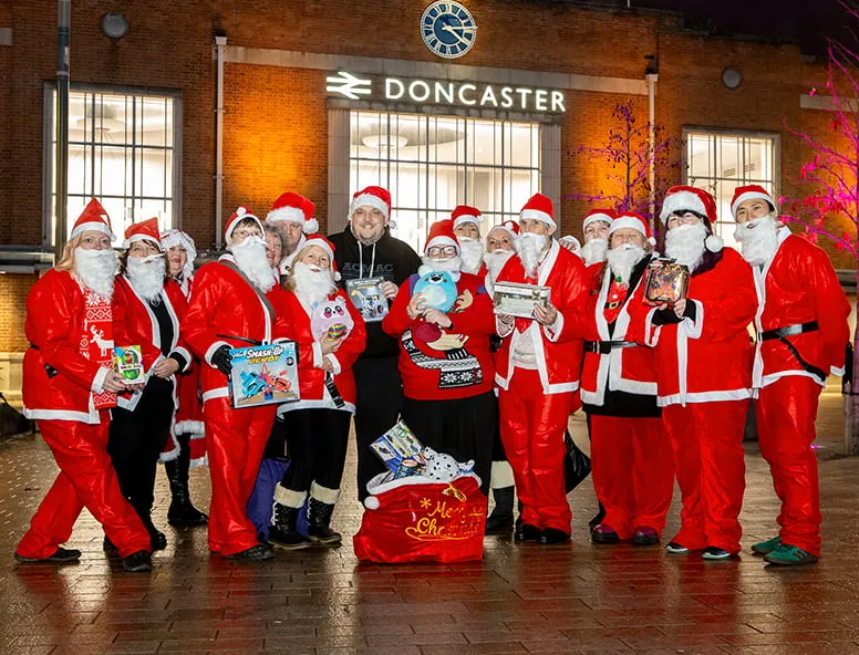 A team of Santa's in Doncaster after travelling with Hull Trains for a charity toy delivery