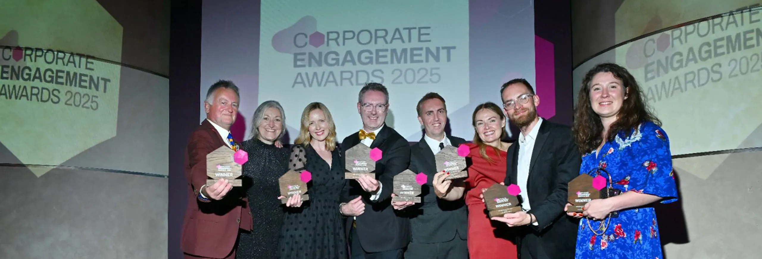 People posing for a winners photo at the Corporate Engagement Awards