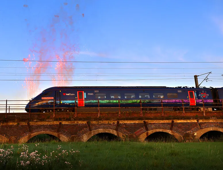 Hull Trains passing over a bridge with fireworks