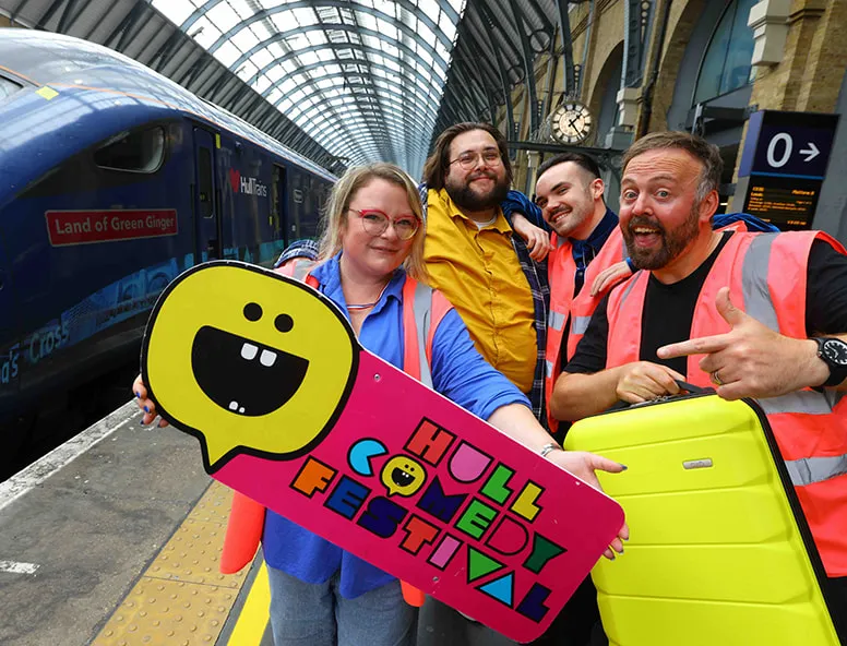 The Hull Comedy Festival team on the platform by a Hull Trains service