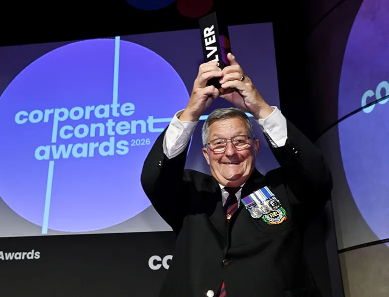 A man holding an award with Hull Trains at the Corporate Content Awards