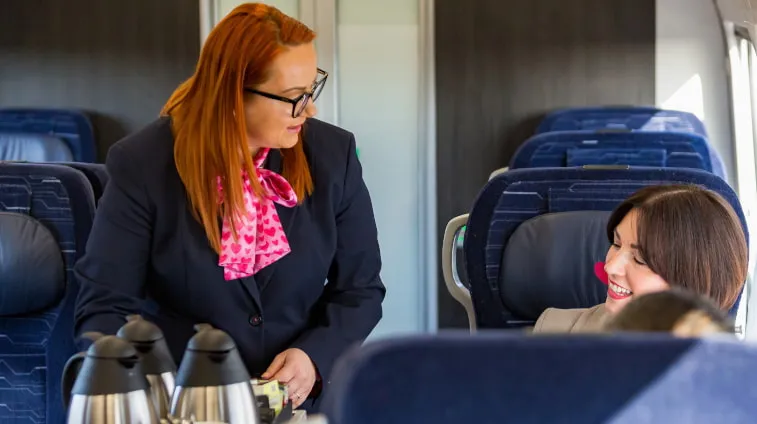 On board host interacting with a passenger