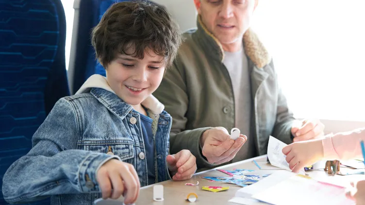 boy playing on board hull trains